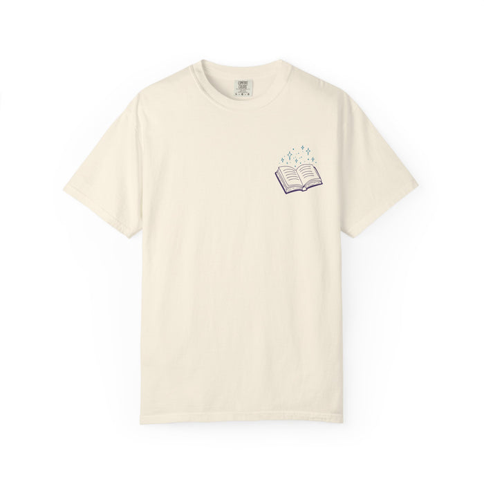 Thtgrlreads Book Bestie collection unisex Comfort Colors graphic tee in vintage cream with a small purple open book and sparkling stars print on the chest.