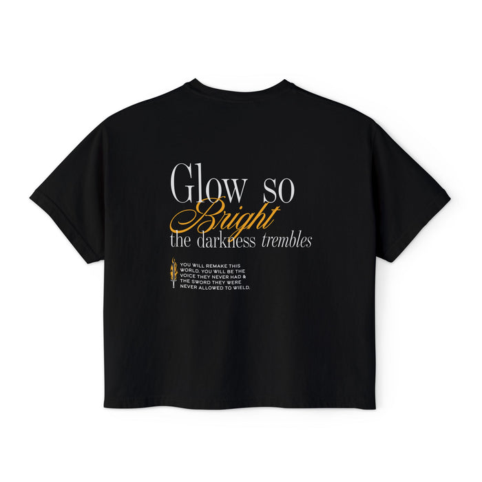Kindred's Curse Saga crop top by thtgrlreads featuring a black Comfort Colors vintage wash crop t-shirt with a text design "Glow so Bright the darkness trembles" in white and gold script, part of officially licensed bookish apparel collections including gid://shopify/Collection/449367539962 and gid://shopify/Collection/467491553530.