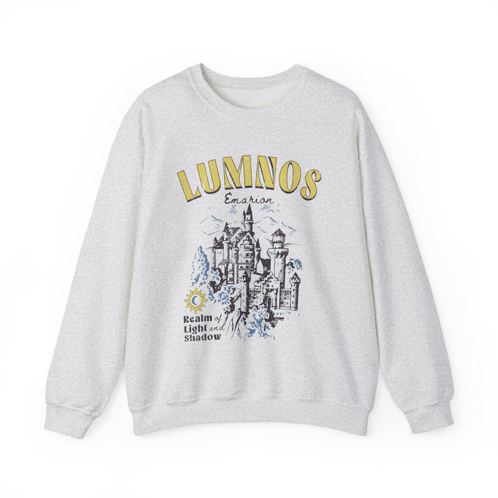 thtgrlreads Kindred's Curse Saga oversized crewneck sweatshirt in vintage-washed light gray with yellow and black graphic print of a fantasy castle and text "Lumnos" and "Realm of Light and Shadow," part of Crewnecks collection.