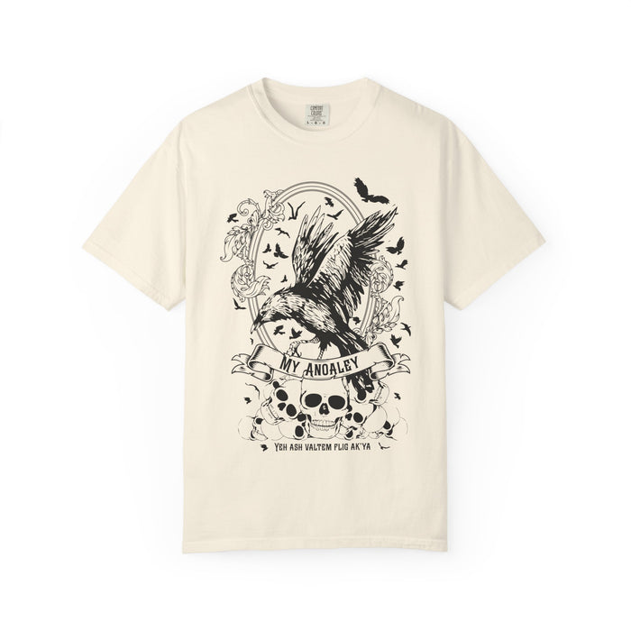 A vintage-wash comfort colors graphic tee from thtgrlreads featuring Liv Zander-inspired fantasy artwork with a detailed black crow, skulls, and gothic script, part of the Liv Zander and Tees collections.