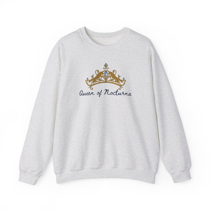 Thtgrlreads Wolves of Ruin officially licensed oversized crewneck sweatshirt featuring a vintage washed Comfort Colors fabric with an embroidered gold crown and gothic script text reading "Queen of Nocturna".
