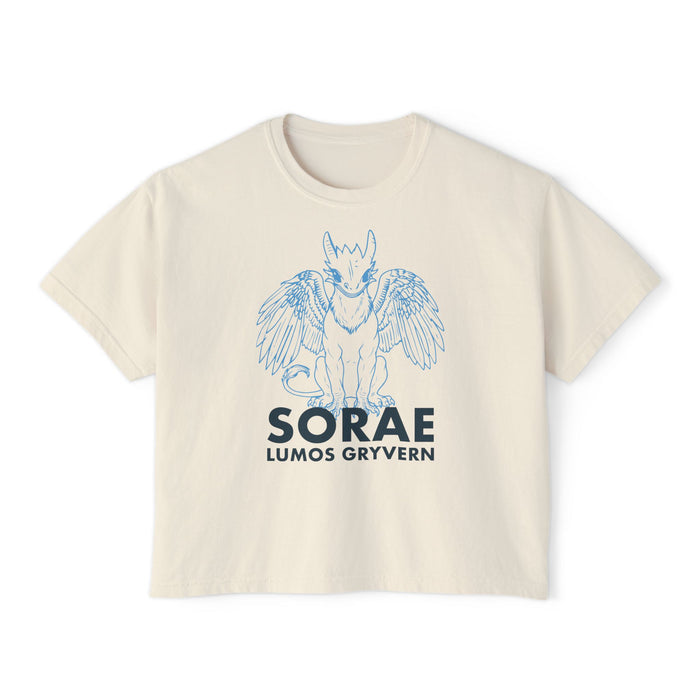thtgrlreads Kindred's Curse Saga cream-colored Comfort Colors cropped t-shirt featuring a vintage-style blue line drawing of a gryvern with wings and bold text beneath, offered by Printify in the Tees collection.