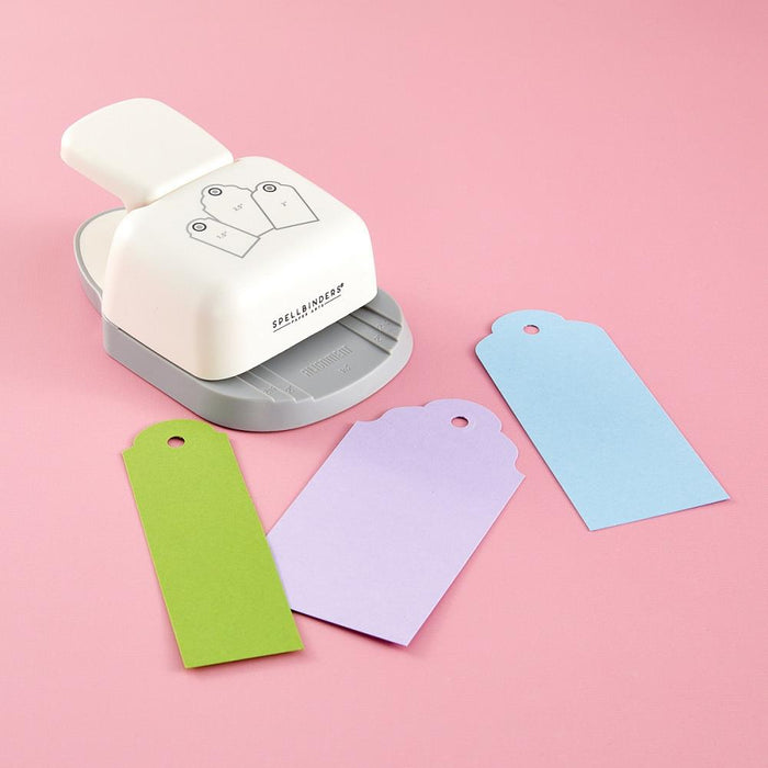 Spellbinders - 3-In-1 Punch - Tag. 3-in-1 Tag Punch makes three different sizes of tags: 1.50 in./38 mm, 2.00 in./51 mm, and 2.50 in./63.5 mm width tags. The easy-to-use guides make accurate paper placement. Available at Embellish Away located in Bowmanville Ontario Canada.