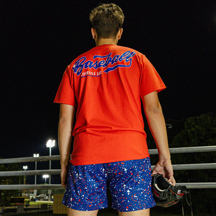 Adult model wearing red, white & blue Splatter USA shorts