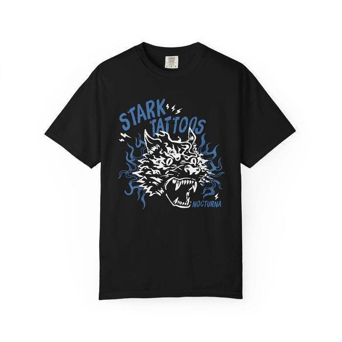 thtgrlreads Nocturna comfort colors graphic tee featuring a vintage-style print of a roaring wolf head surrounded by blue flames with "Stark Tattoos" text in bold lettering