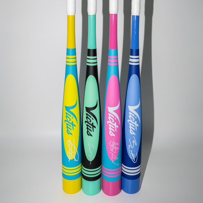 A group of colorful baseball bats, including the durable and high-performing 2025 Victus Vibe Pro-Crayon Julio Rodriguez (-8) USSSA bat from Victus.