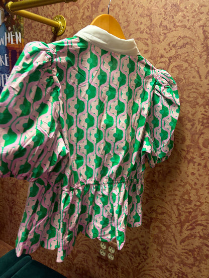 Entro Mod floral blouse with colorful pattern, long sleeves, and a relaxed fit, displayed on a hanger.