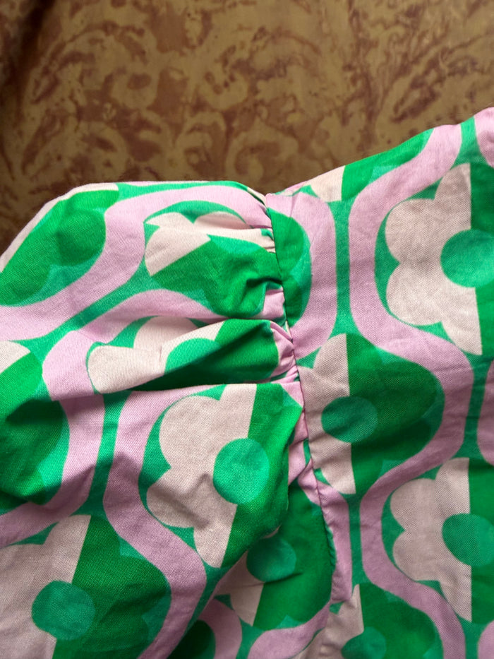 Entro mod floral blouse with lightweight fabric and vibrant floral pattern, long sleeves, and a relaxed fit.