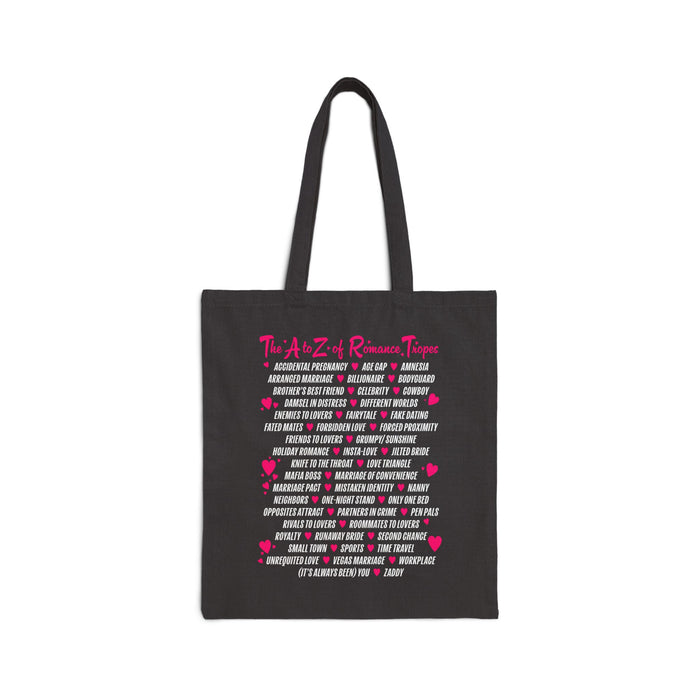 Book Bestie collection tote bag by thtgrlreads featuring vintage-washed black fabric with bright pink and white romance trope text in a playful block print, perfect for romantasy fans.