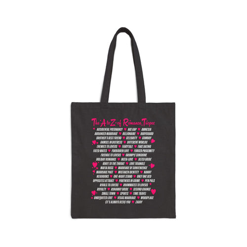 Book Bestie collection tote bag by thtgrlreads featuring vintage-washed black fabric with bright pink and white romance trope text in a playful block print, perfect for romantasy fans.