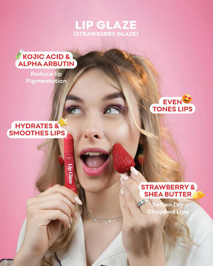 A woman with blonde hair holds a red Lip Glaze tube in one hand and a strawberry in the other, set against a solid pink background with text overlays describing the lip glaze benefits and flavor.