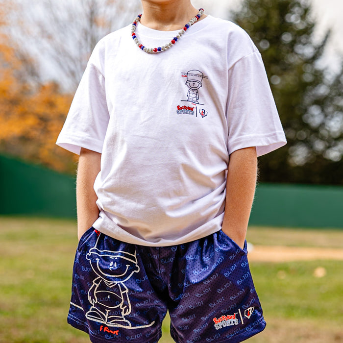 Person wearing a white t-shirt with Pablo Sanchez cartoon and blue shorts Pablo Sanchez shorts