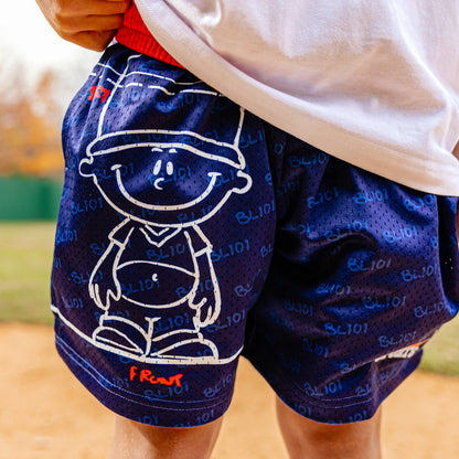 Navy blue shorts with Pablo Sanchez design worn by a person on a sports field.