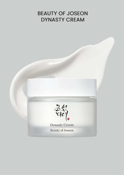 Beauty of Joseon Dynasty Cream jar with a white cream smear on a gray background