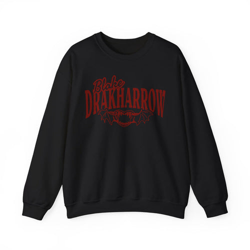 Black oversized crewneck sweatshirt from the Bloodwing Academy collection by Thtgrlreads, featuring vintage red gothic script and bat graphic inspired by Blake Drakharrow.