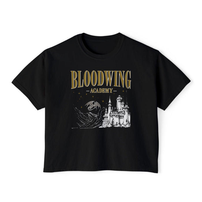 Black vintage-wash Comfort Colors crop top from thtgrlreads featuring Bloodwing Academy gothic script print and detailed castle graphic, part of official Bloodwing Academy tees.