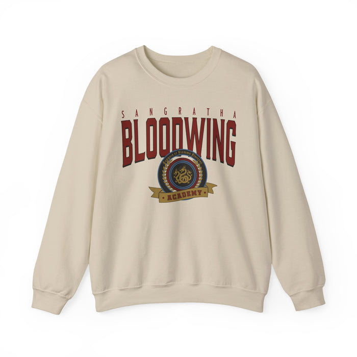Thtgrlreads Bloodwing Academy crewneck sweatshirt featuring a vintage wash, Comfort Colors base with a bold printed crest graphic, part of officially licensed romantasy merch.