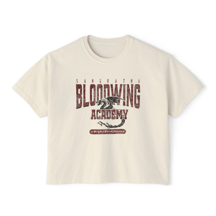 Bloodwing Academy crop top from thtgrlreads features a vintage wash Comfort Colors fabric with a distressed dragon graphic and bold Bloodwing Academy text, part of the Tees collection.
