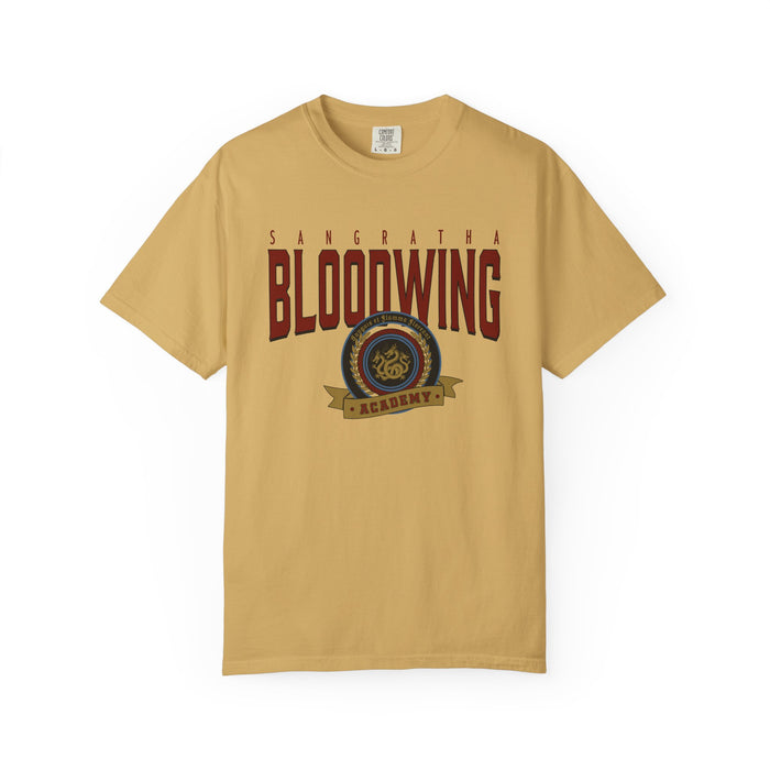 Thtgrlreads Bloodwing Academy collection featuring a vintage wash Comfort Colors graphic tee in muted gold with bold maroon text and a circular emblem, perfect for Back to School fans.