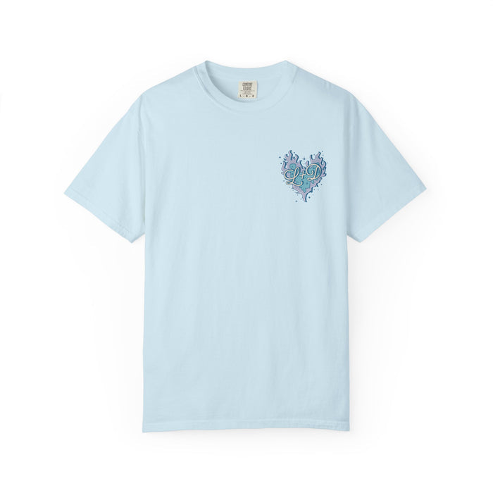thtgrlreads light blue Comfort Colors graphic tee featuring a small, intricate heart-shaped design with swirling botanical elements in teal and navy tones on the chest, offering a vintage wash and relaxed unisex fit.
