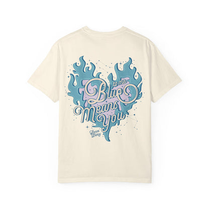 Thtgrlreads Zodiac Academy collection comfort colors graphic tee featuring a vintage wash cream base with a blue flame heart and pastel pink and blue "Blue means you" script design.