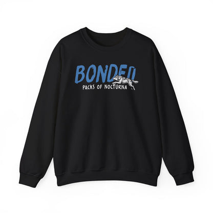 thtgrlreads Wolves of Ruin collection oversized crewneck sweatshirt featuring a vintage puff print graphic of a running wolf and the word "BONDED" in blue, made with soft Comfort Colors fabric by Printify.