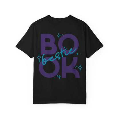 Thtgrlreads Book Bestie collection black Comfort Colors graphic tee featuring bold purple "BOOK" text with blue handwritten "bestie" overlay and star accents, unisex fit.