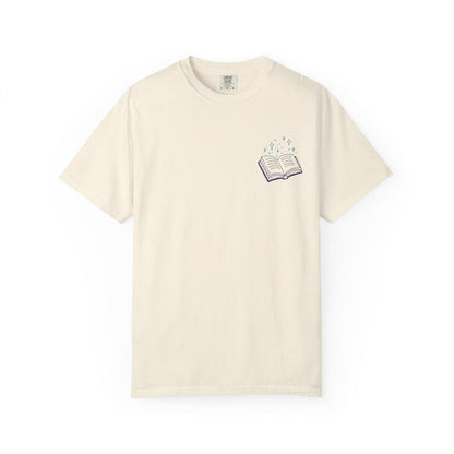 Thtgrlreads Book Bestie collection unisex Comfort Colors graphic tee in vintage cream with a small purple open book and sparkling stars print on the chest.