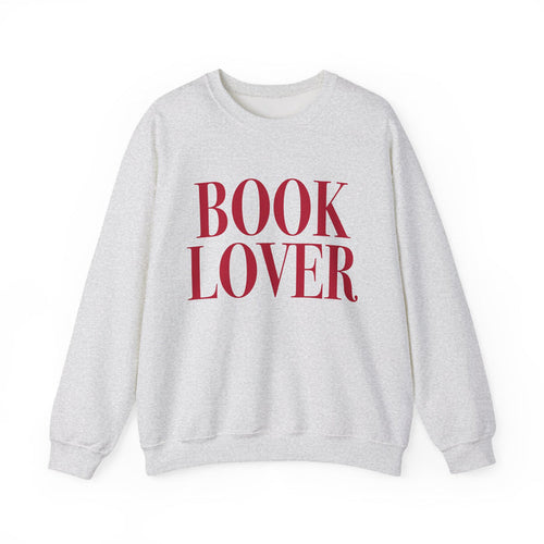 Thtgrlreads crewneck from the Crewnecks collection features a vintage-washed Comfort Colors fabric with bold red "BOOK LOVER" text printed on a cozy, unisex sweatshirt.