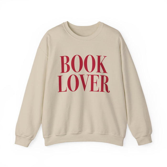 thtgrlreads cozy Comfort Colors crewneck from the Crewnecks collection featuring bold vintage puff print text "BOOK LOVER" in deep red on a soft beige, relaxed fit sweatshirt.