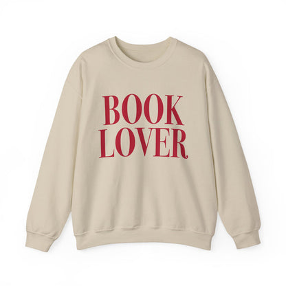 thtgrlreads cozy Comfort Colors crewneck from the Crewnecks collection featuring bold vintage puff print text "BOOK LOVER" in deep red on a soft beige, relaxed fit sweatshirt.