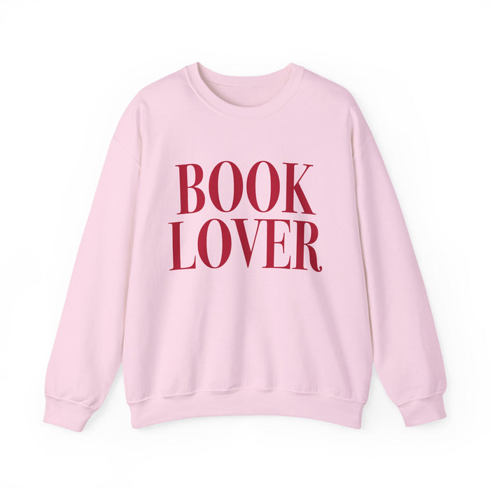 Thtgrlreads cozy Comfort Colors oversized crewneck from the Crewnecks collection features a vintage-washed soft pink fabric with bold red "BOOK LOVER" text, perfect for bookish apparel fans.