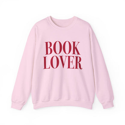 Thtgrlreads cozy Comfort Colors oversized crewneck from the Crewnecks collection features a vintage-washed soft pink fabric with bold red "BOOK LOVER" text, perfect for bookish apparel fans.