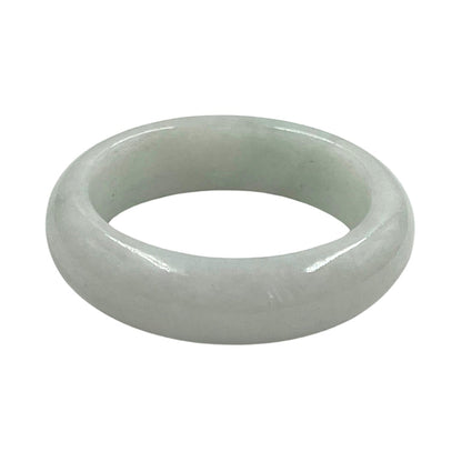 A smooth, polished light green jade bangle ring on a solid white background.