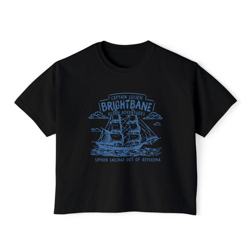 thtgrlreads Wolves of Ruin collection crop top featuring a vintage wash black Comfort Colors fabric with detailed blue line art of a sailing ship and gothic script, Printify tee.