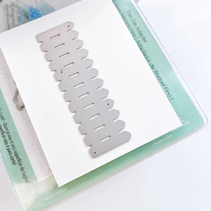 Catherine Pooler - Die - White Picket Fence. This gorgeous White Picket Fence Die helps complete the scene for so many of your cards. Available at Embellish Away located in Bowmanville Ontario Canada.