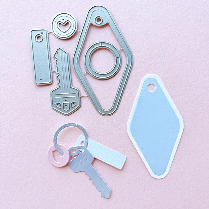 Catherine Pooler - Dies - Suite Motel Key. Create your own Suite Motel Key set with these fun dies. The dies include a key die, tags and "metal" keyring dies for so many fun layering options. Available at Embellish Away located in Bowmanville Ontario Canada.