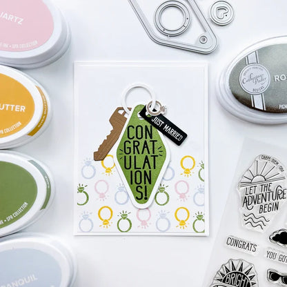 Catherine Pooler - Dies - Suite Motel Key. Create your own Suite Motel Key set with these fun dies. The dies include a key die, tags and "metal" keyring dies for so many fun layering options. Available at Embellish Away located in Bowmanville Ontario Canada. Example by brand ambassador.