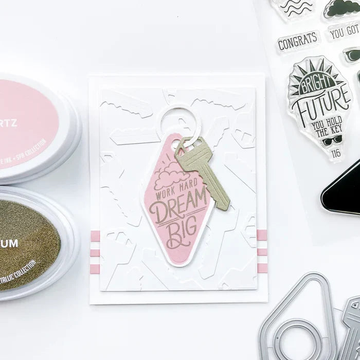 Catherine Pooler - Dies - Suite Motel Key. Create your own Suite Motel Key set with these fun dies. The dies include a key die, tags and "metal" keyring dies for so many fun layering options. Available at Embellish Away located in Bowmanville Ontario Canada. Example by brand ambassador.