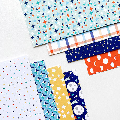 Catherine Pooler - Patterned Paper - Under The Stars. This pack of 6" x 6" patterned paper, Under The Stars, is designed by Becca Bonneville for Catherine Pooler Designs and is part of the Under The Stars Collection. Available at Embellish Away located in Bowmanville Ontario Canada.