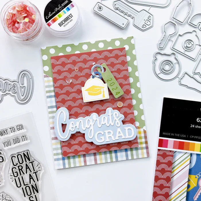 Catherine Pooler - Word Die - Congrats Grad. Celebrate all the graduates in your life with the Congrats Grad Word Die. Available at Embellish Away located in Bowmanville Ontario Canada. Example by brand ambassador.