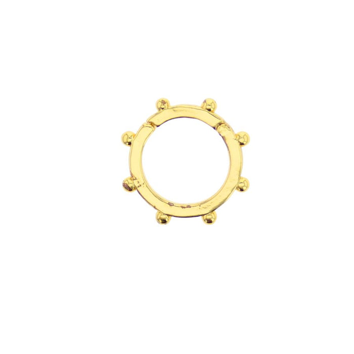 Gold-tone open-circle ring with decorative bead studs around the bezel
