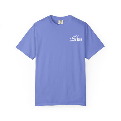 A vintage-washed Comfort Colors graphic tee in soft lavender featuring a small white serif and script font print that reads "Club Slow Burn," part of thtgrlreads’ Book Bestie collection.