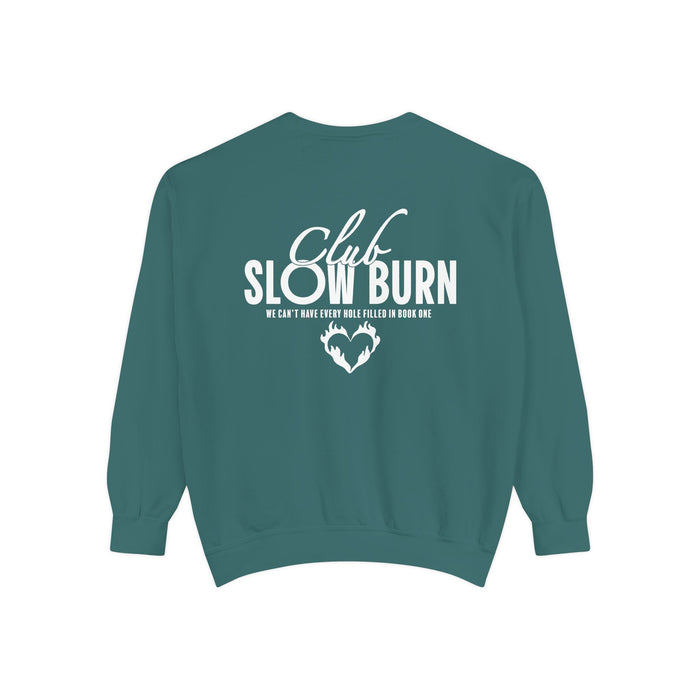 A vintage-washed Comfort Colors oversized crewneck sweatshirt in teal featuring white graphic text "Club Slow Burn" and a heart design, officially licensed by thtgrlreads, perfect for Book Bestie and Crewnecks collections.