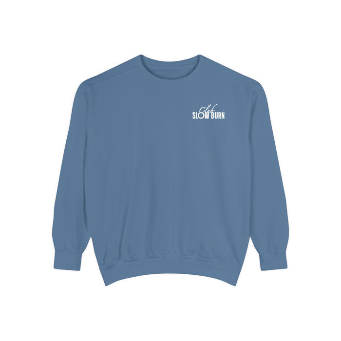 A vintage-wash blue oversized crewneck sweatshirt from thtgrlreads featuring a small white "Slow Burn" text graphic on the chest, part of the Book Bestie and Crewnecks collections.