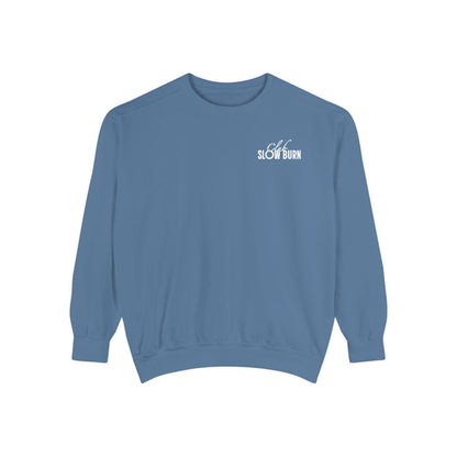 A vintage-wash blue oversized crewneck sweatshirt from thtgrlreads featuring a small white "Slow Burn" text graphic on the chest, part of the Book Bestie and Crewnecks collections.