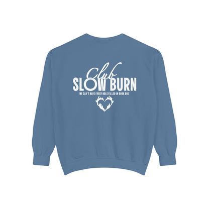 thtgrlreads Crewnecks and Book Bestie collection oversized crewneck sweatshirt in vintage-washed blue Comfort Colors featuring bold white printed "Club Slowburn" text and a small flame heart graphic.