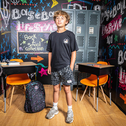 Adult model wearing black shorts with “Composition” design