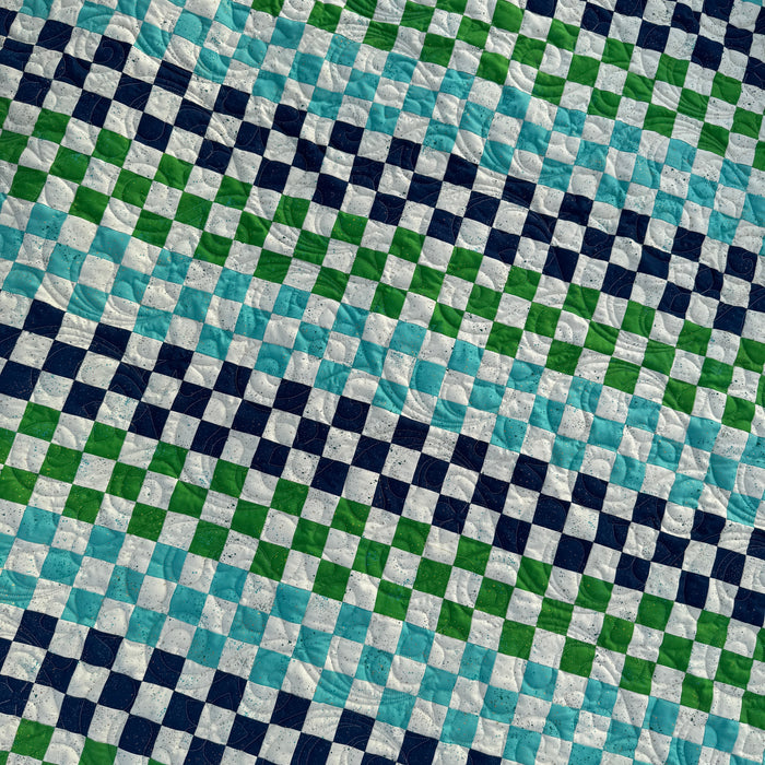 Checkered fabric pattern with blue, green, and white squares