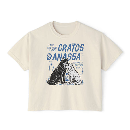 Thtgrlreads Wolves of Ruin collection cream comfort colors crop top featuring a vintage-style blue graphic of two wolves with "Cratos & Anassa" text, available via Printify.